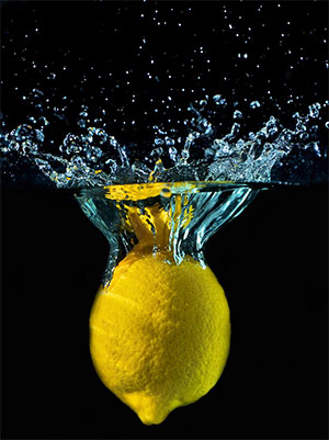 Lemon Splashes in Water on Black