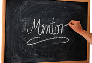 Chalkboard with the word Mentor written on it.